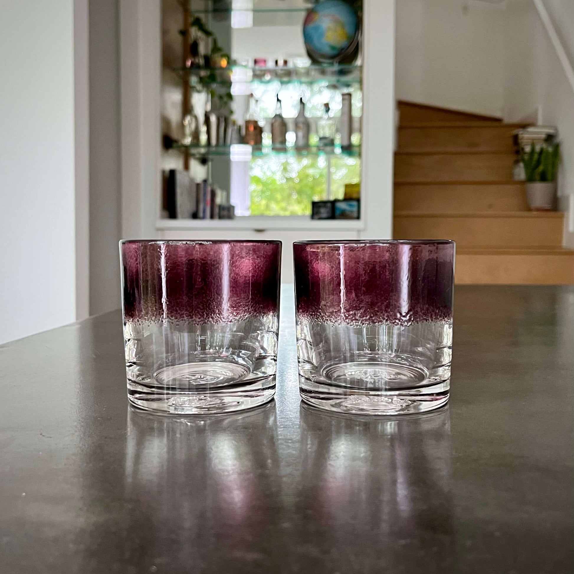 https://shop.bourbonbanter.com/cdn/shop/products/Royal-Rocks-Glasses-Purple-Bar.jpg?v=1650374672&width=1946